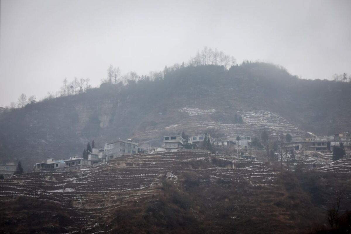 At least 20 dead and 24 missing after landslide in southwestern China  / MARK R. CRISTINO